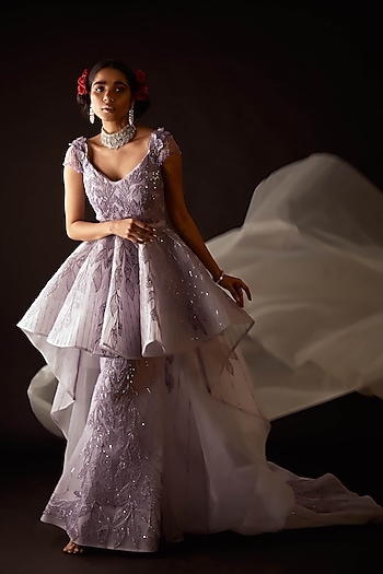 Enter like the belle of the ball in this couture gown by Amit GT. Pick exquisite jewels from Aster to add some bling to your look by Couture Excellence